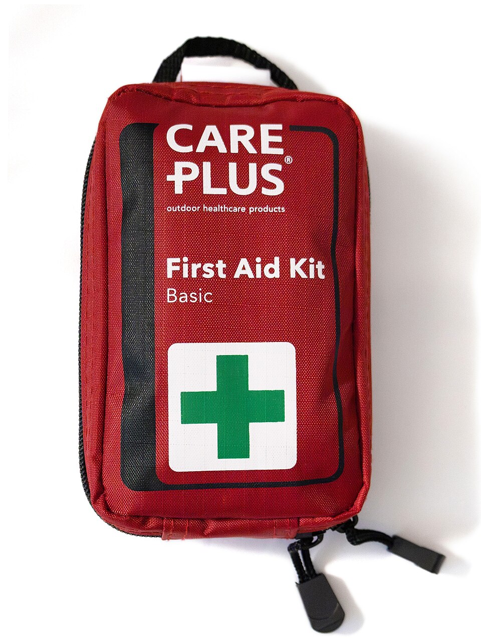 A red zippered pouch labeled First Aid Kit with a green cross, for storm prep in Pensacola, FL